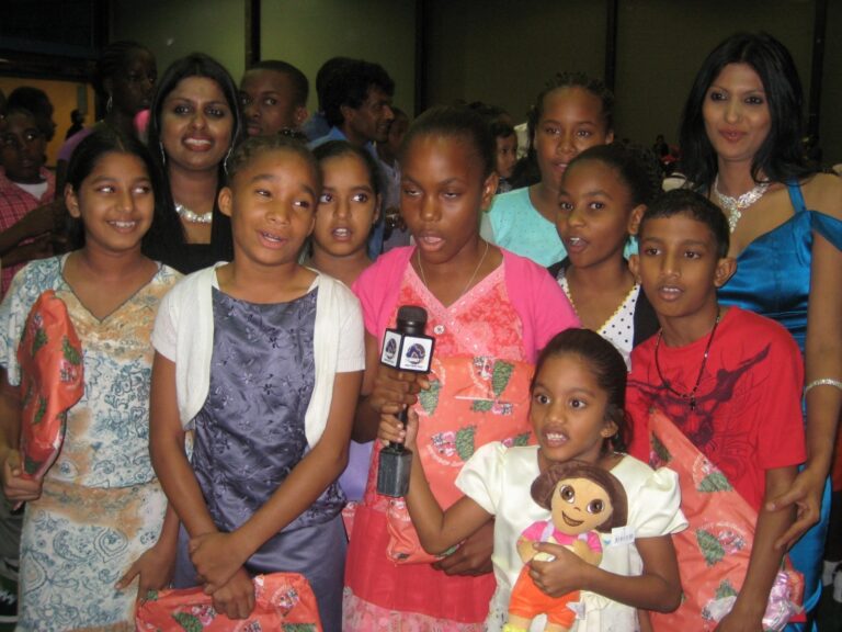 GFLF members and Children -with Gifts caht with the media