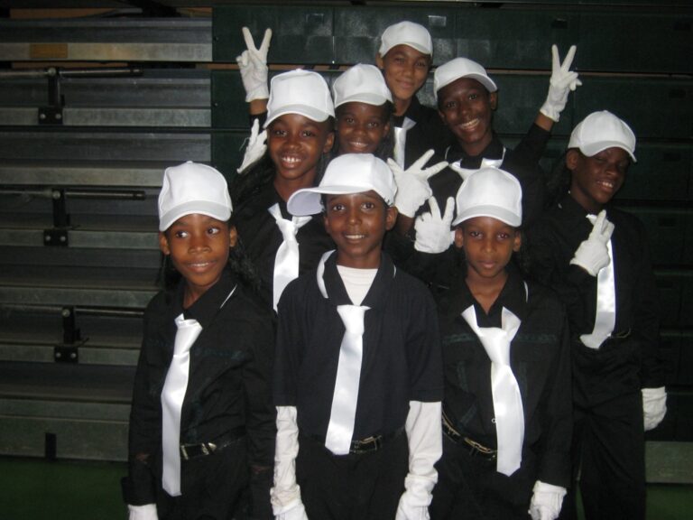 The Jesus Cares Family Cottage, Arima , all smartly dressed perform on stage