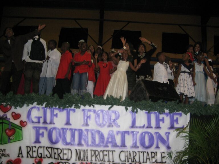 GFLF members join the children on stage to sing -We are the world , We are the Children