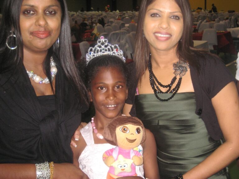 GFLF members takes a shot with this beautiful princess from Jesus Cares Cottage- gifts are courtesy Calvin and Shameel Adams